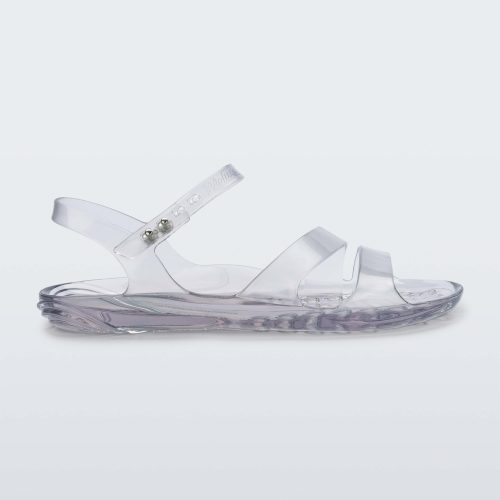 Side view of a clear Melissa Real Jelly Sandal with two front straps and an ankle strap.