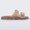 Side view of a brown Melissa Brave Wide slide with a brown base, velcro straps and a translucent brown insole.