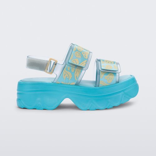 SIde view of blue Melissa Brave Platform sandals with smiley face print on straps.