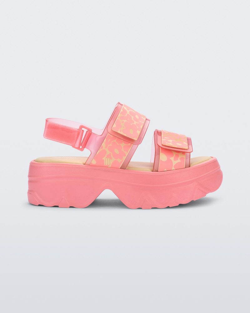 Side view of pink Melissa Brave Platform sandal with flower print straps.