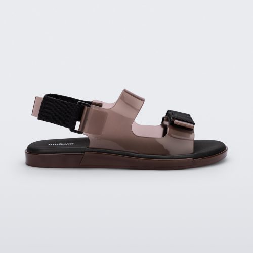 Side view of a brown Melissa Brave Papete sandal with two straps, a brown base, black sole, and a front and back black velcro strap.