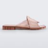 Side view of a pink Melissa Brigitte slide with a solid and transparent weft designed upper strap.