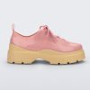 Side view of a pink Melissa Funky sneaker with pink laces and a chunky yellow sole.