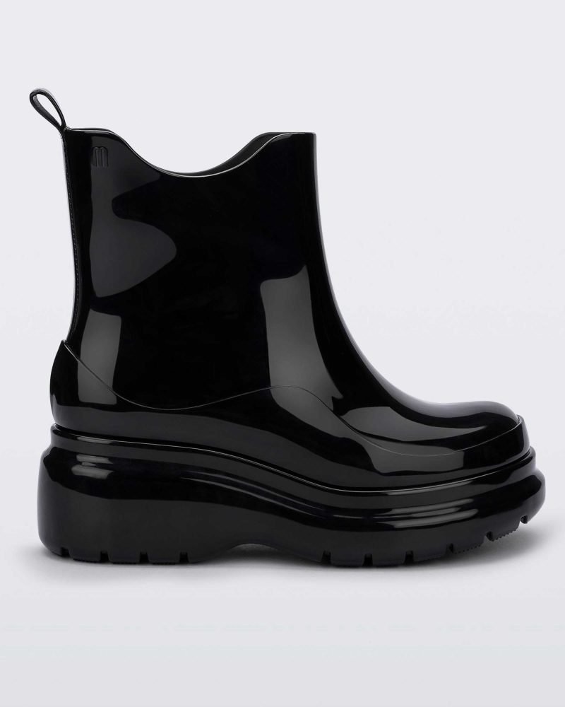 Side view of a black Melissa Grip short rain boot.