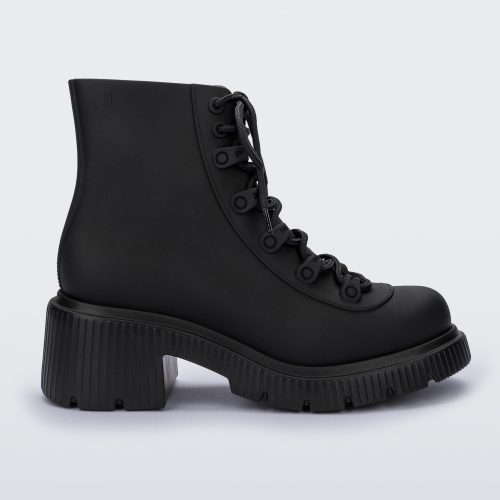 Side view of a matte black Melissa Cosmo boots with a black base, laces and heel sole, laying on their side.