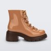 Side view of a bronze/beige Melissa Cosmo boots with a bronze/beige base, laces and a brown heel sole.