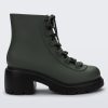 Side view of a green/black Melissa Cosmo boot.