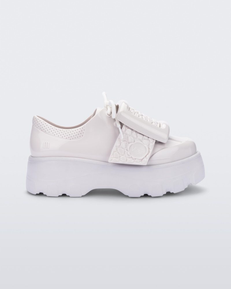 Side view of white Melissa Buckle Up Kick Off platform sneaker.