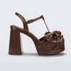 Side view of a Melissa Tie Party platform heel in brown with 3D bow detail and ankle strap with buckle.