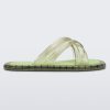 Side view of transparent green Melissa Cali slides with cross straps.