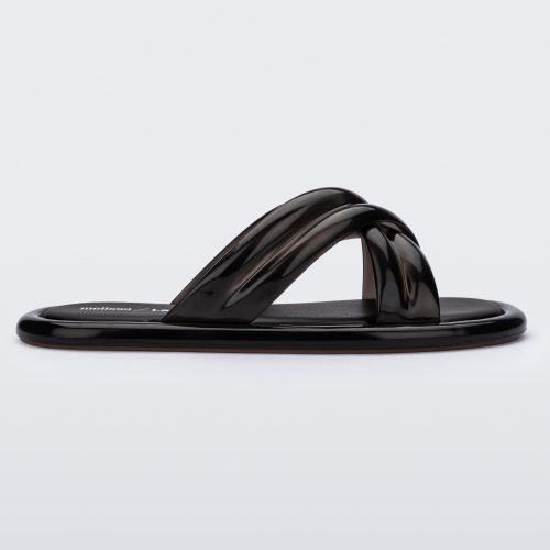 Side view of a black Melissa Cali slide with cross straps.