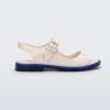 Side view of white Melissa Bae white sandal with a blue sole.