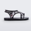 Side view of black Mini Melissa Acqua sandal with Mickey Mouse print.