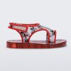 Side view of red Mini Melissa Acqua sandal with a Mickey Mouse print.