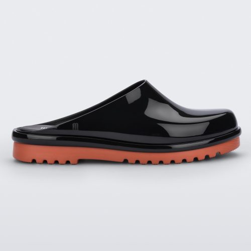 Side view of a black Melissa Smart Clog with a black base and an orange/brown sole.