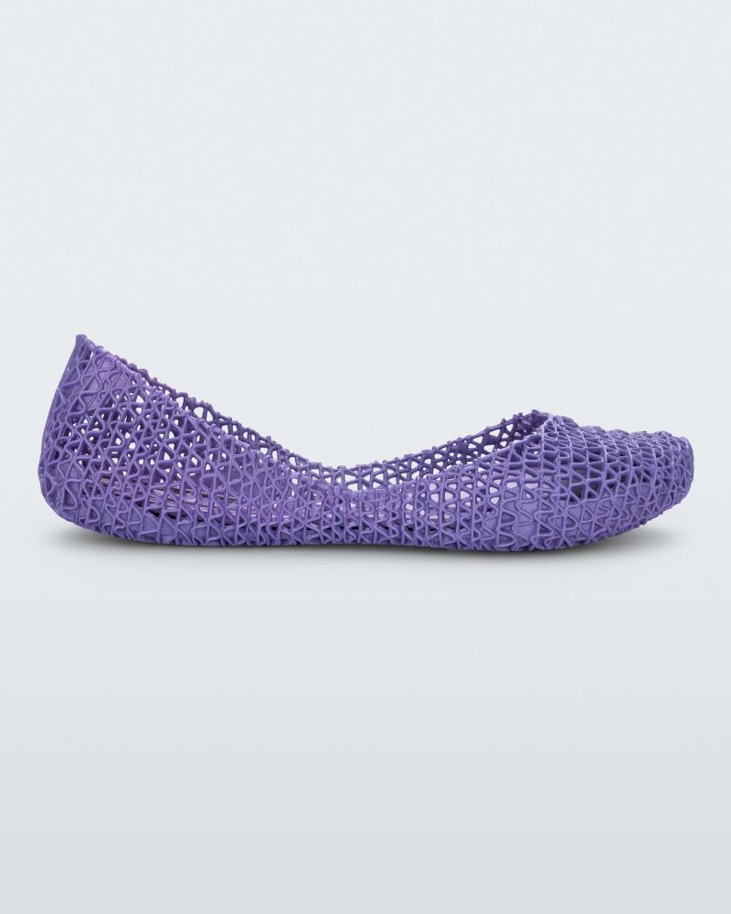 Side view of a purple Melissa Campana flat with an open woven texture.