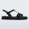 Side view of a Melissa Party sandal in black with back ankle strap and buckle closure