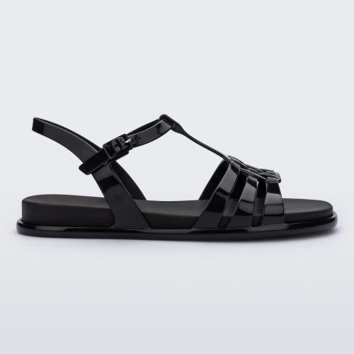 Side view of a Melissa Party sandal in black with back ankle strap and buckle closure 