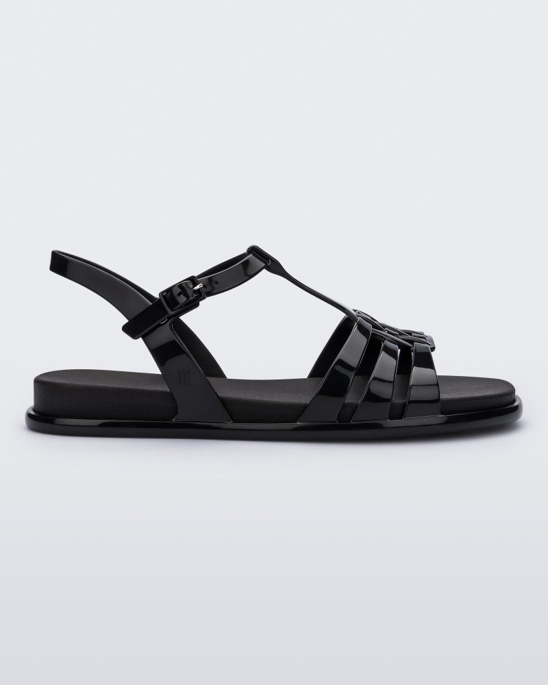 Side view of a Melissa Party sandal in black with back ankle strap and buckle closure