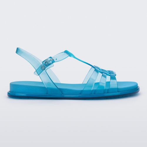 Side view of a Melissa Party sandal in transparent blue with back ankle strap and buckle closure