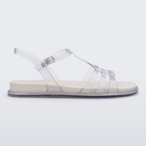 Side view of a clear Melissa Party sandal with back ankle strap and buckle closure.