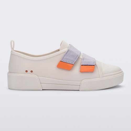 Side view of a matte beige/lilac Melissa Cool sneaker with two orange and lilac velcro straps.