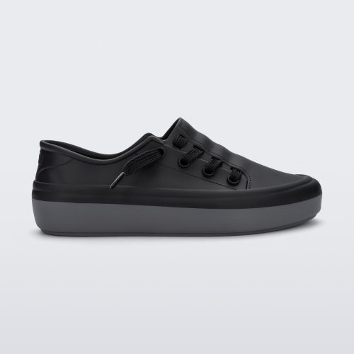 Side view of a black Melissa Ulitsa sneaker with a black base, laces and a gray sole.