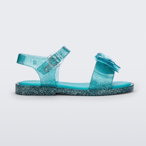 Side view of a glitter blue Mini Melissa Mar Sandal with a bow.