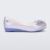 Side view of a pearly blue Mini Melissa Ultragirl flat with a pearly blue base and a heart buckle bow detail on the toe.