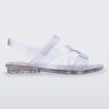 Side view of a clear Mini Melissa The Real Jelly Paris sandal with three front straps and an ankle strap.