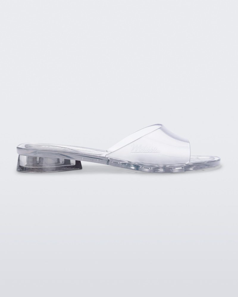 Side view of a transparent clear Melissa Kim slide.