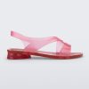 Side view of a pink/red Melissa The Real Jelly Paris sandal with two front straps and an ankle strap.