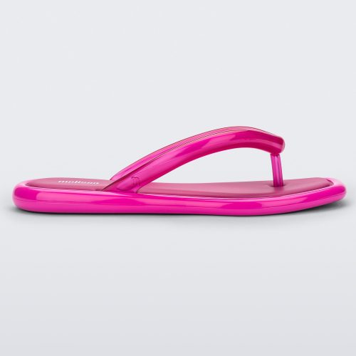 Side view of dark pink Melissa Airbubble Flip Flop.