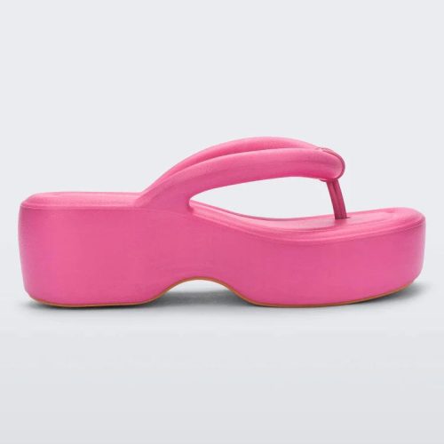 Side view of a pink Melissa Free Platform flip flop with puffer-like straps.