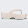 Side view of a beige Melissa Free Platform flip flop with puffer-like straps.