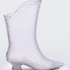 Side view of a pair of transparent glass looking Melissa Court Boots with a short heel, heart detail on the front and a checkered pattern texture.