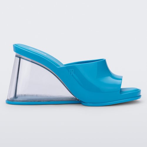 Side view of a blue Melissa Darling heel with a clear sole.