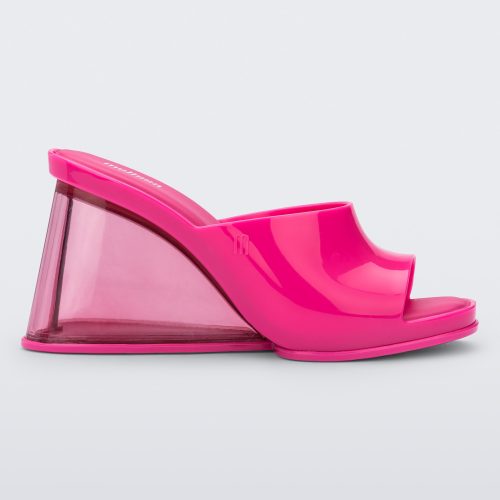 Side view of a pink Melissa Darling heel with a clear sole.