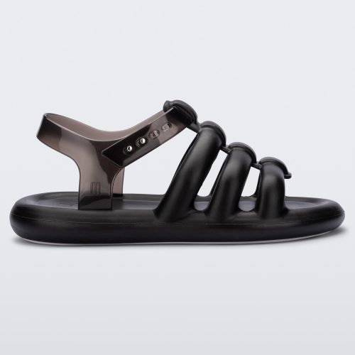 Side view of a black Melissa Freesherman sandal with black and clear straps.