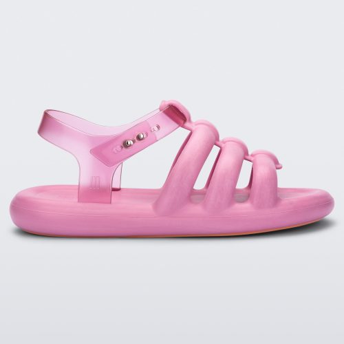 Side view of a pink Melissa Freesherman sandal with pink and clear straps.