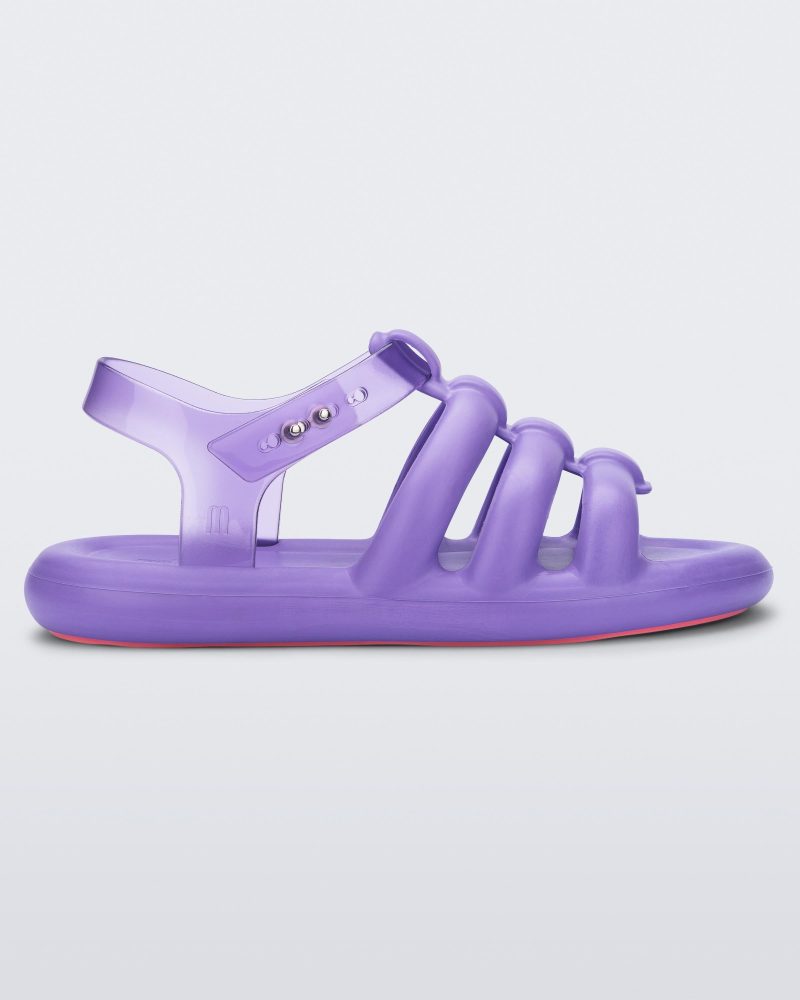 Side view of a lilac Melissa Freesherman sandal with lilac and clear straps.