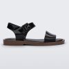 Side view of a black/brown Melissa Mar sandal with two black straps and a brown sole.