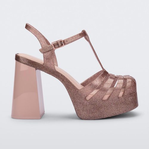 Side view of a pink glitter Melissa Party platform heel.