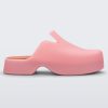 Side view of a pink Melissa Zoe mule and orange insoles.