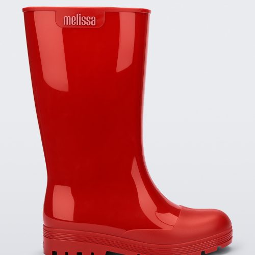 Side view of a red Melissa Welly boot.