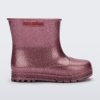 Side view of a glitter pink baby Melissa Welly boot.