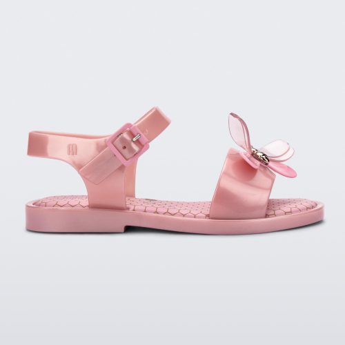 Side view of a pearly pink Mini Melissa Mar Bugs sandal with a honeycomb pattern insole and a pink bug detail with a gold buckle on the front.