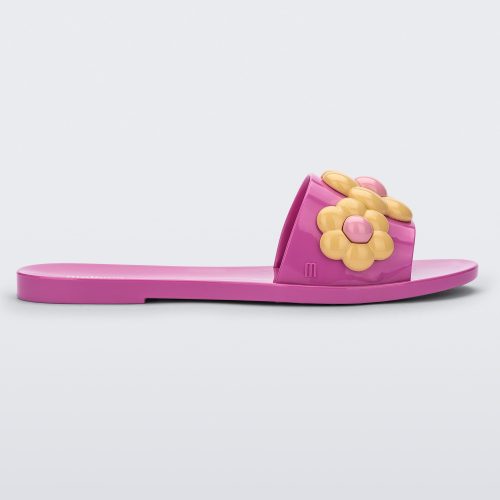 Side view of purple Melissa Babe Spring slide with yellow flowers.