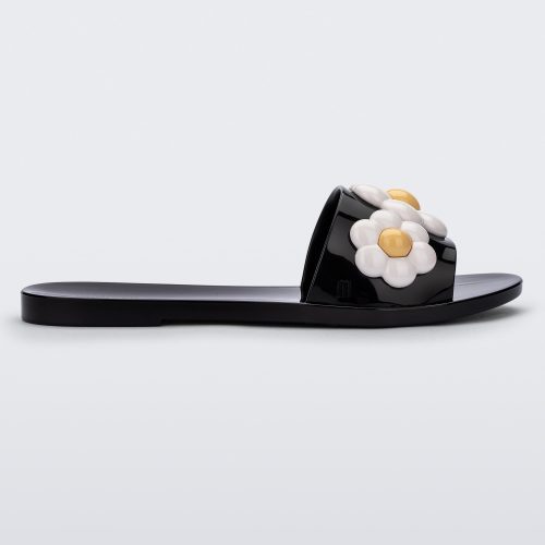 Side view of black Melissa Babe Spring slide with white flowers.