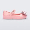 Side view of a pink Mini Melissa Sweet Love baby mary jane flat with a metallic pink bow.